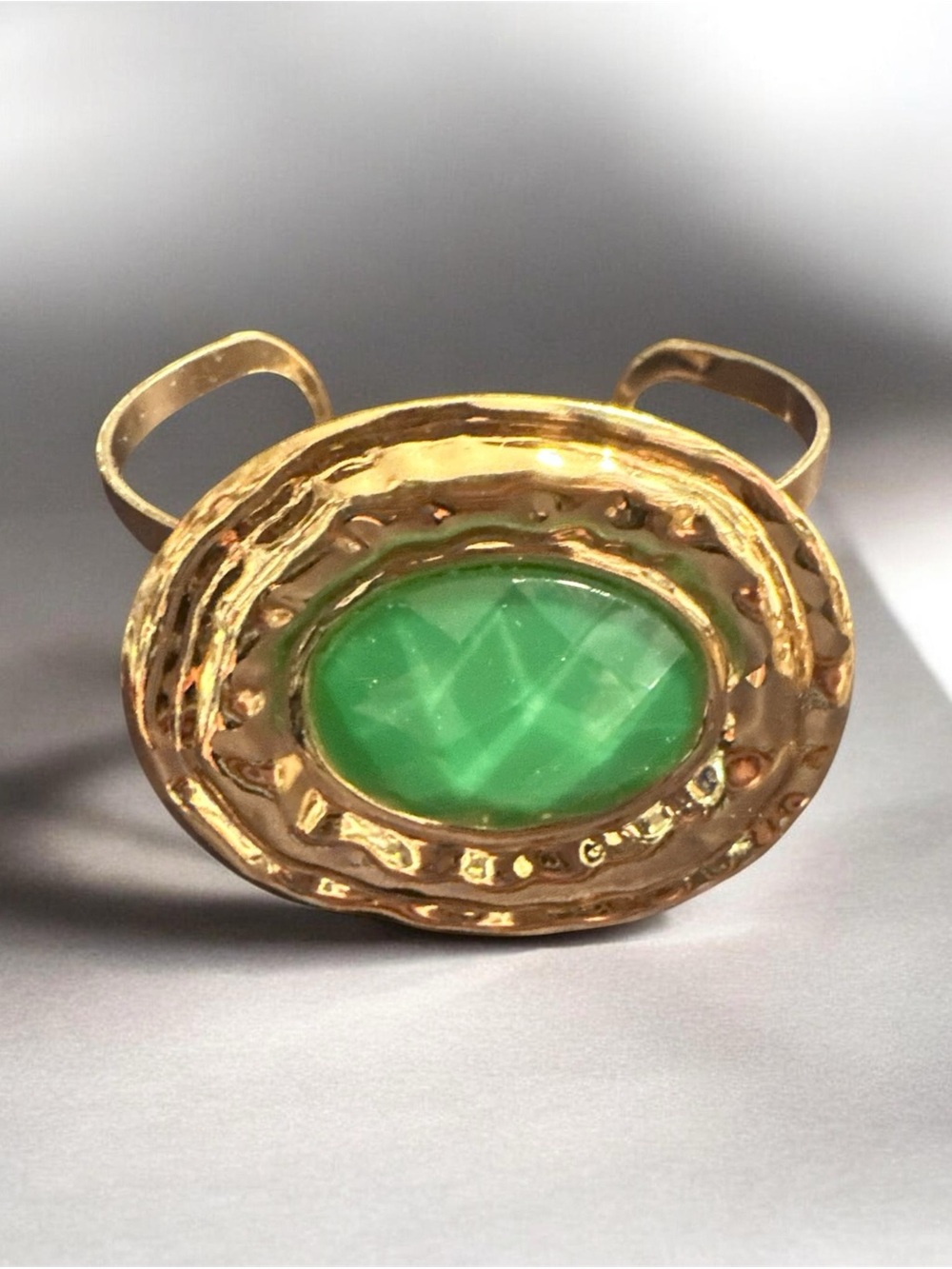 Gold-Tone Cuff Ring with Green Oval Stone
432